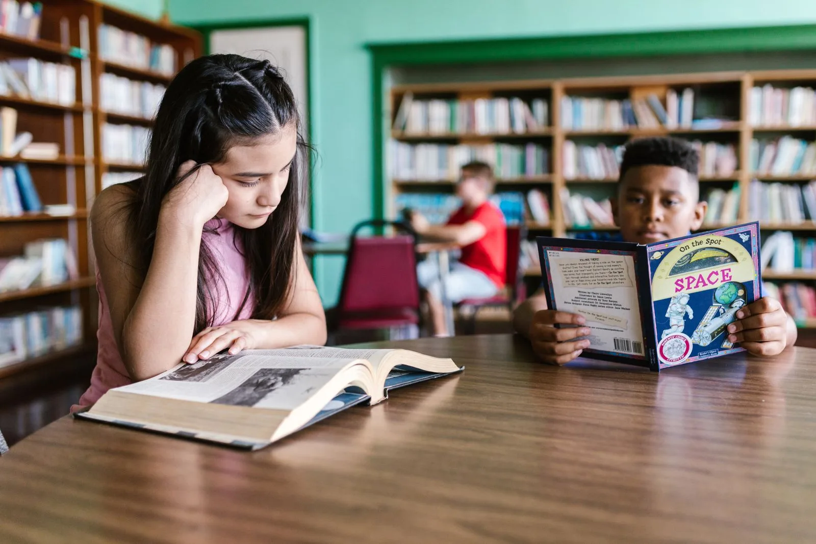 Students reading and studying together in the school library