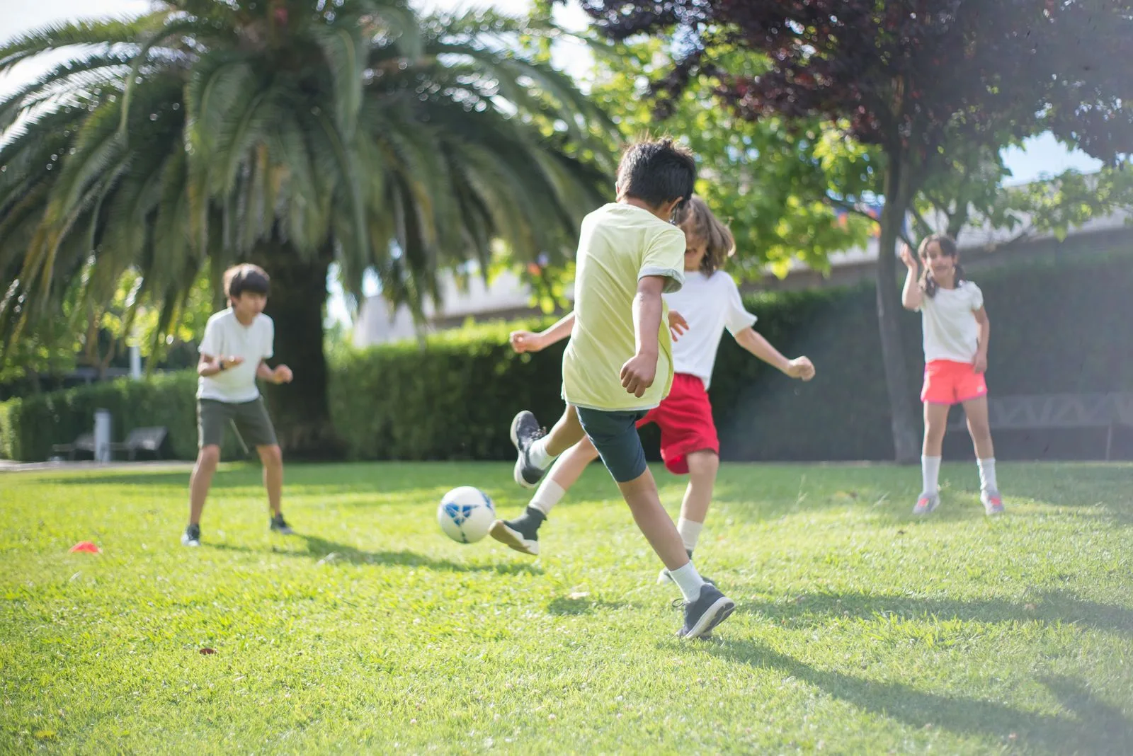 Students playing football together on the school field
